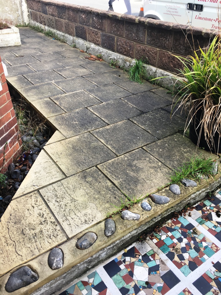 Buff Patio Paving Before Cleaning in Eastbourne