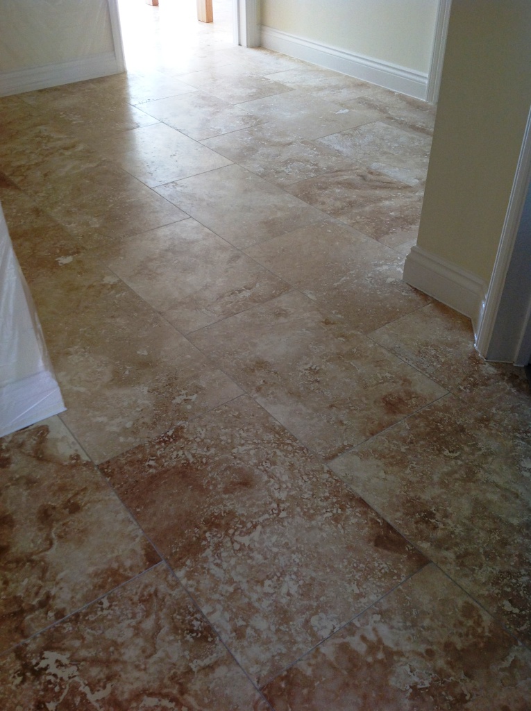 Travertine floor before honing and polishing Polegate